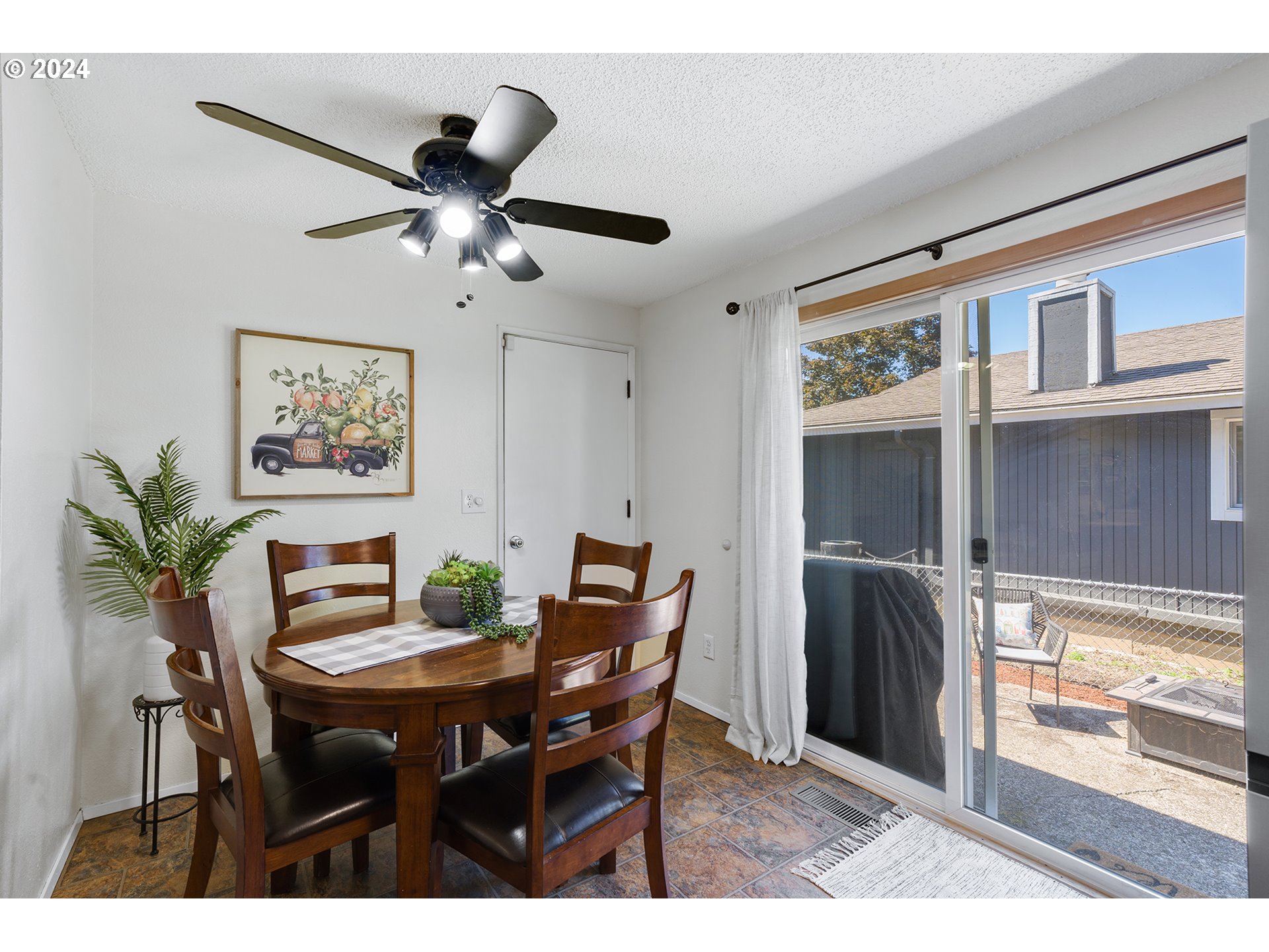 7946 Southeast 103rd Avenue Portland, OR 97266 - Photo 15 of 32 a view of a dining room with furniture window and outside view