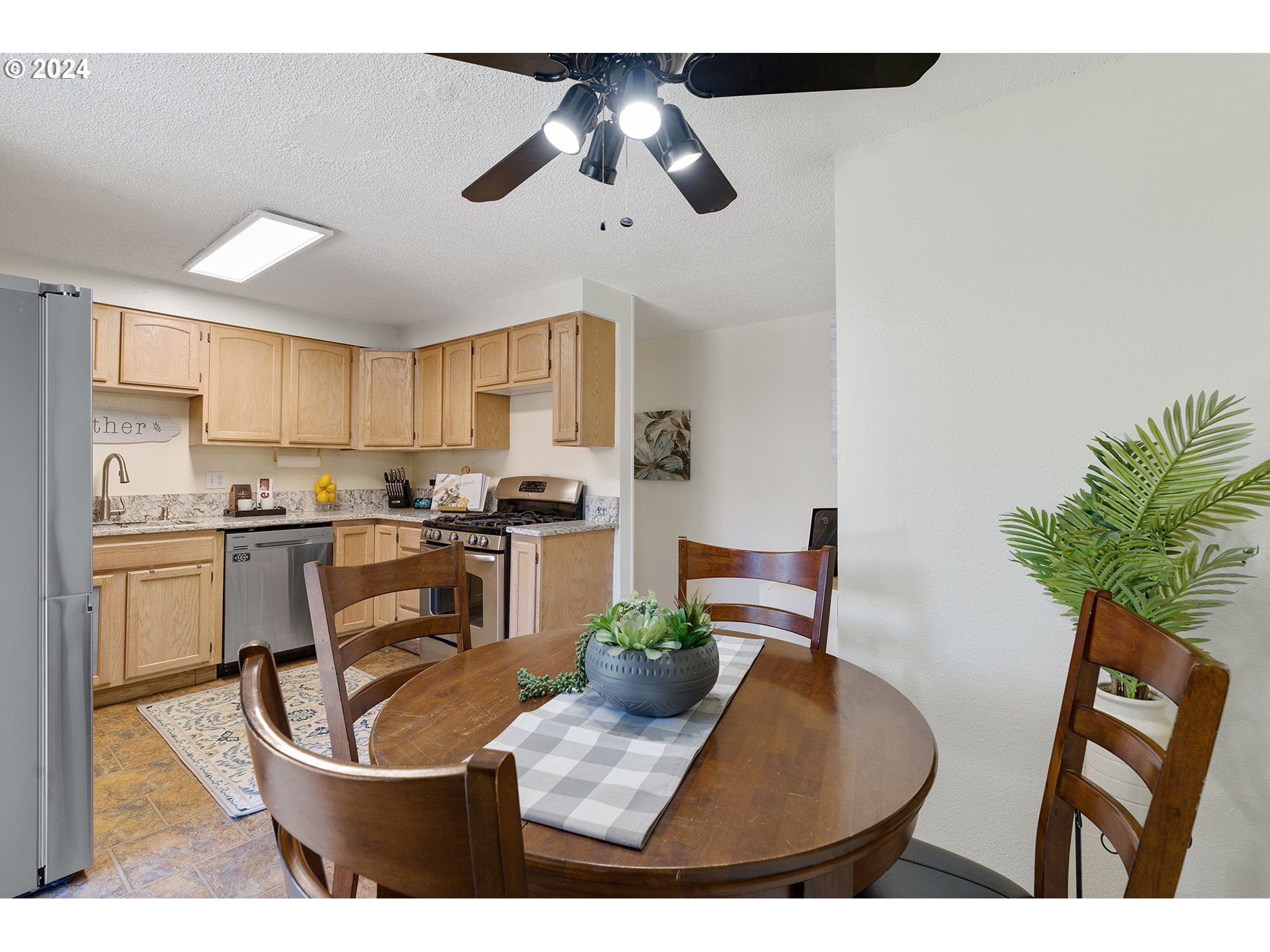 7946 Southeast 103rd Avenue Portland, OR 97266 - Photo 16 of 32 a kitchen with appliances and cabinets
