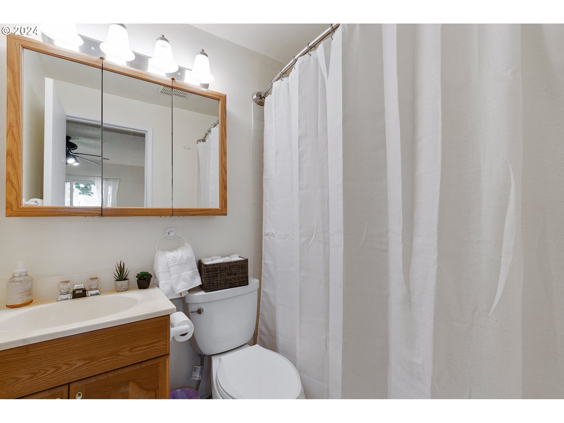 7946 Southeast 103rd Avenue Portland, OR 97266 - Photo 19 of 32 a bathroom with a sink and a mirror