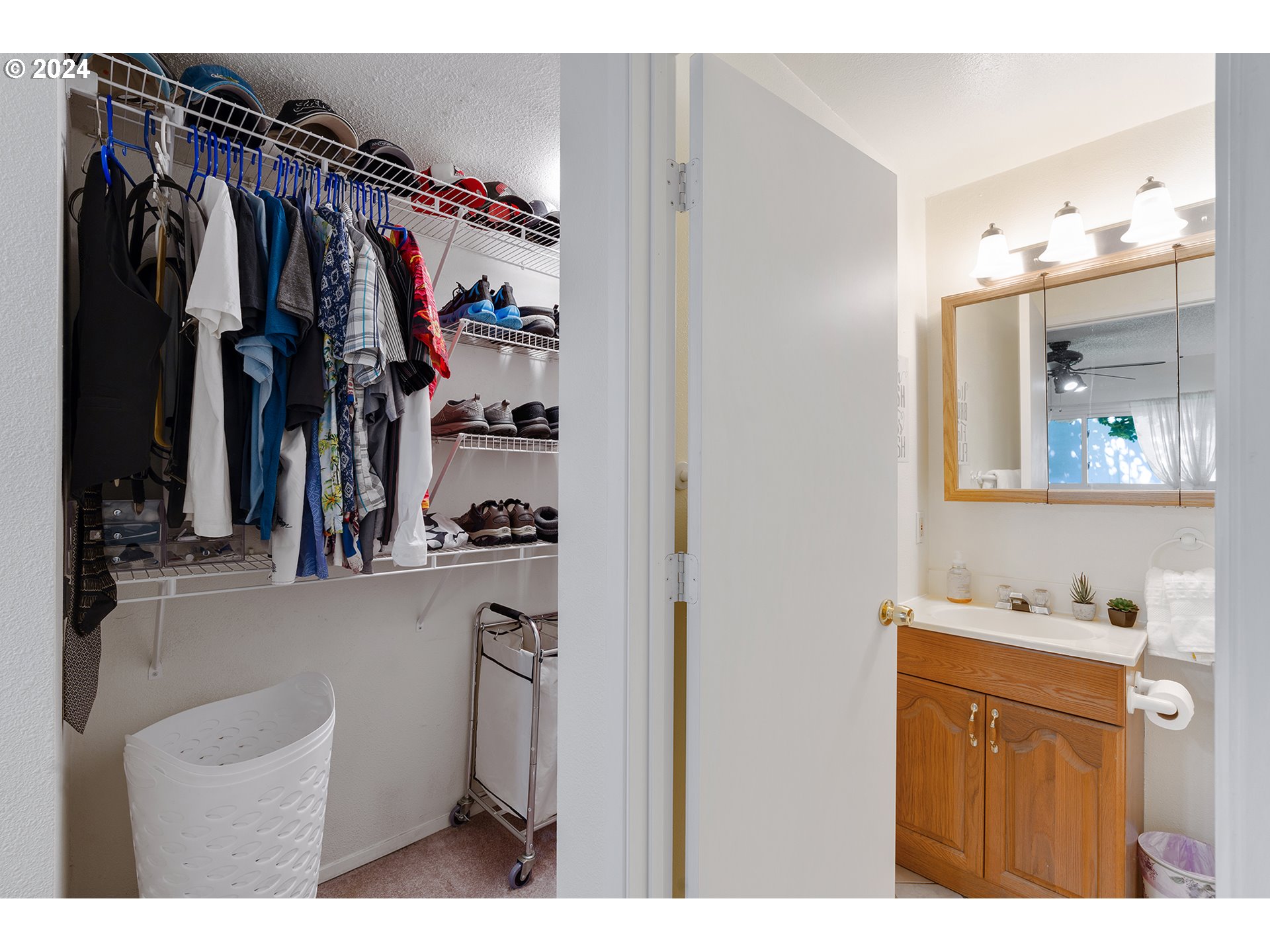 7946 Southeast 103rd Avenue Portland, OR 97266 - Photo 20 of 32 a view of walk in closet with clothes and shoes