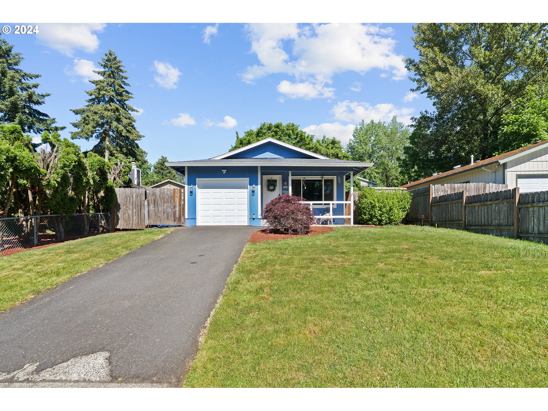7946 Southeast 103rd Avenue Portland, OR 97266 - Photo 2 of 32 a view of a house with a yard