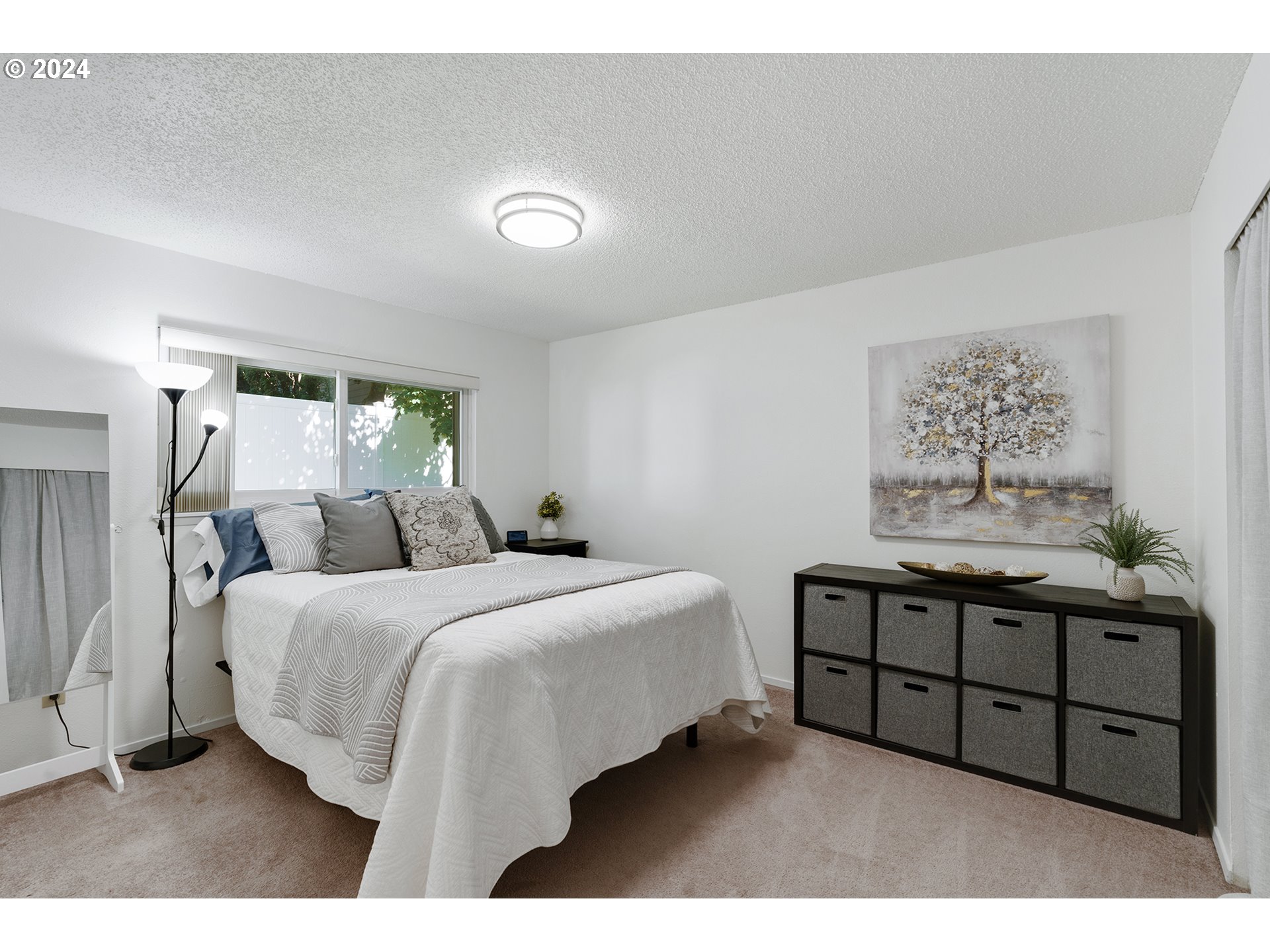 7946 Southeast 103rd Avenue Portland, OR 97266 - Photo 22 of 32 a bed room with a bed and window