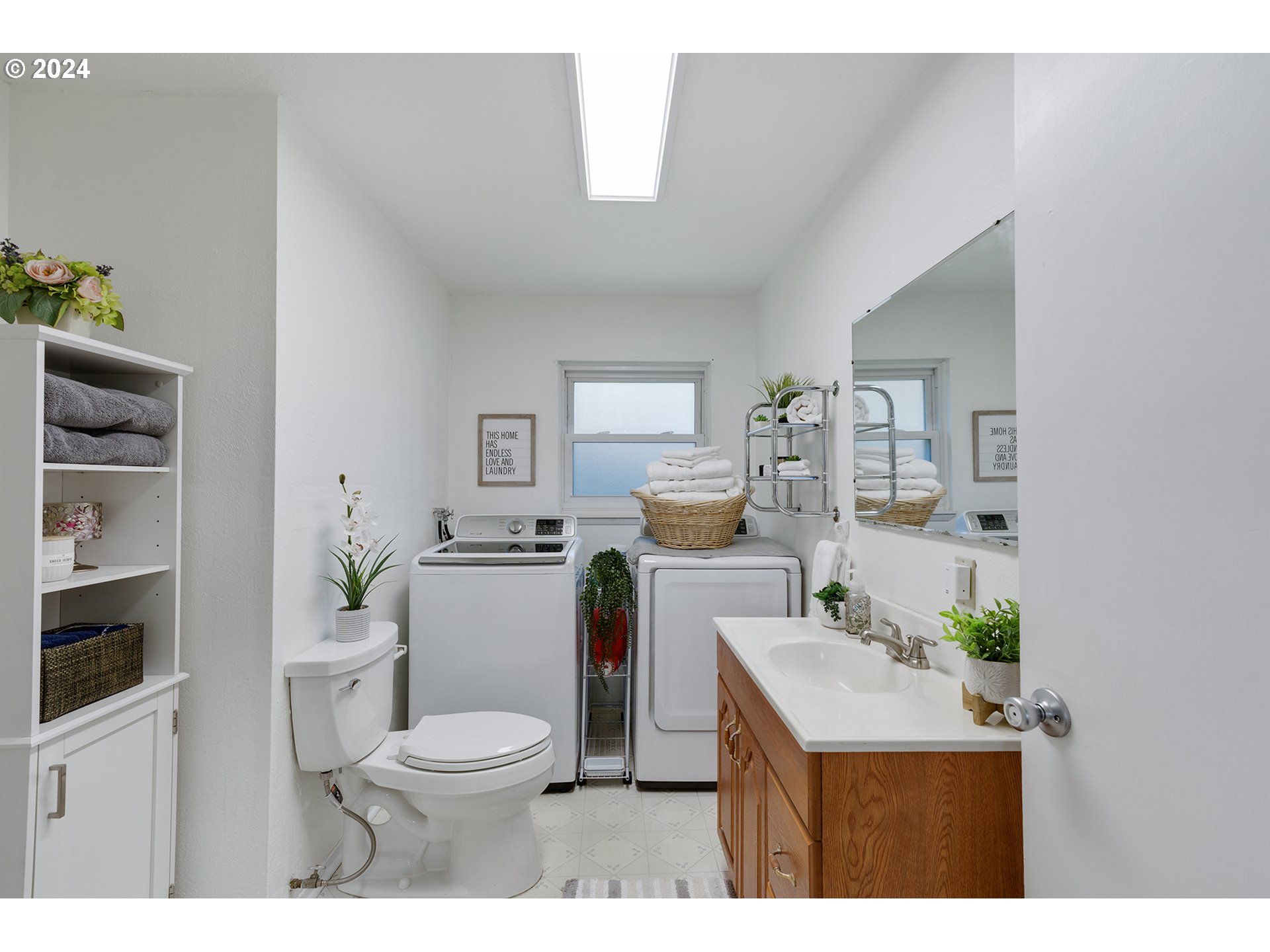 7946 Southeast 103rd Avenue Portland, OR 97266 - Photo 24 of 32 a bathroom with a sink a toilet and shower
