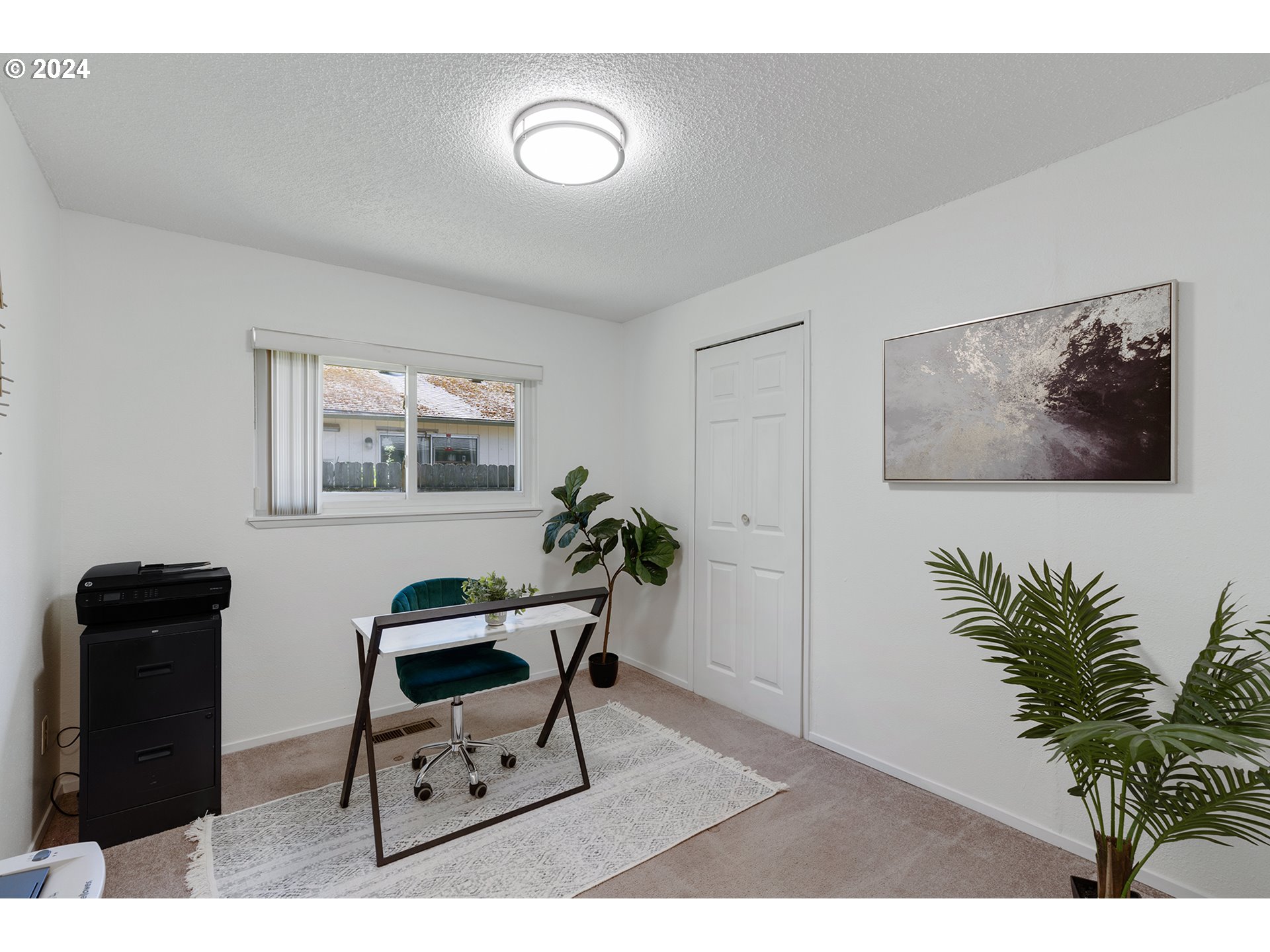 7946 Southeast 103rd Avenue Portland, OR 97266 - Photo 25 of 32 a living room with furniture and a flat screen tv