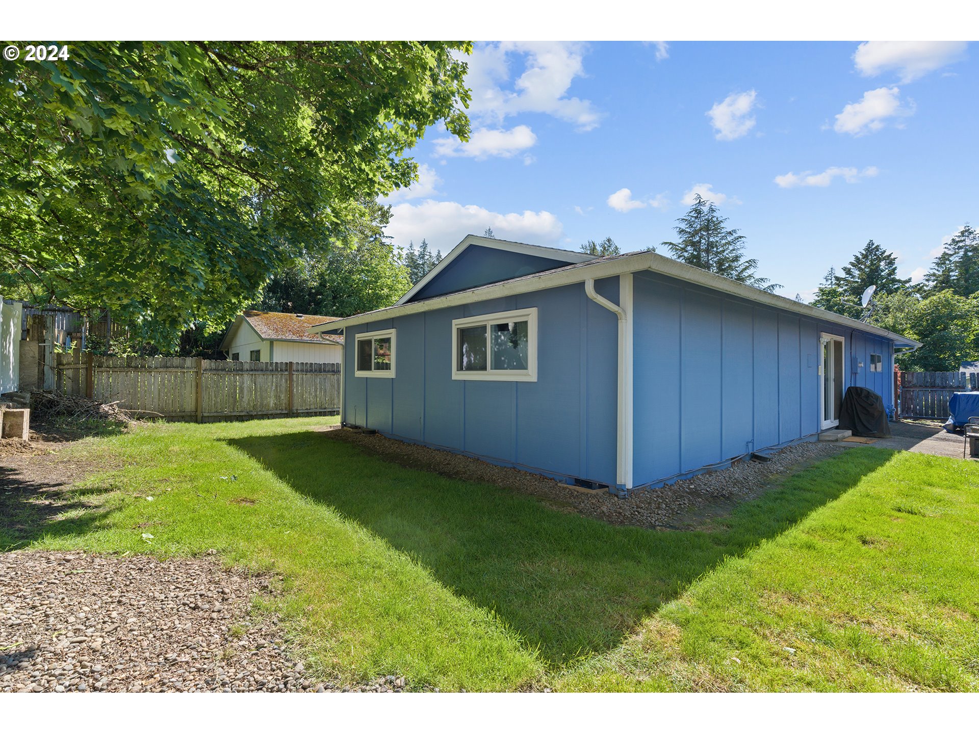 7946 Southeast 103rd Avenue Portland, OR 97266 - Photo 29 of 32 a backyard of a house with lots of green space