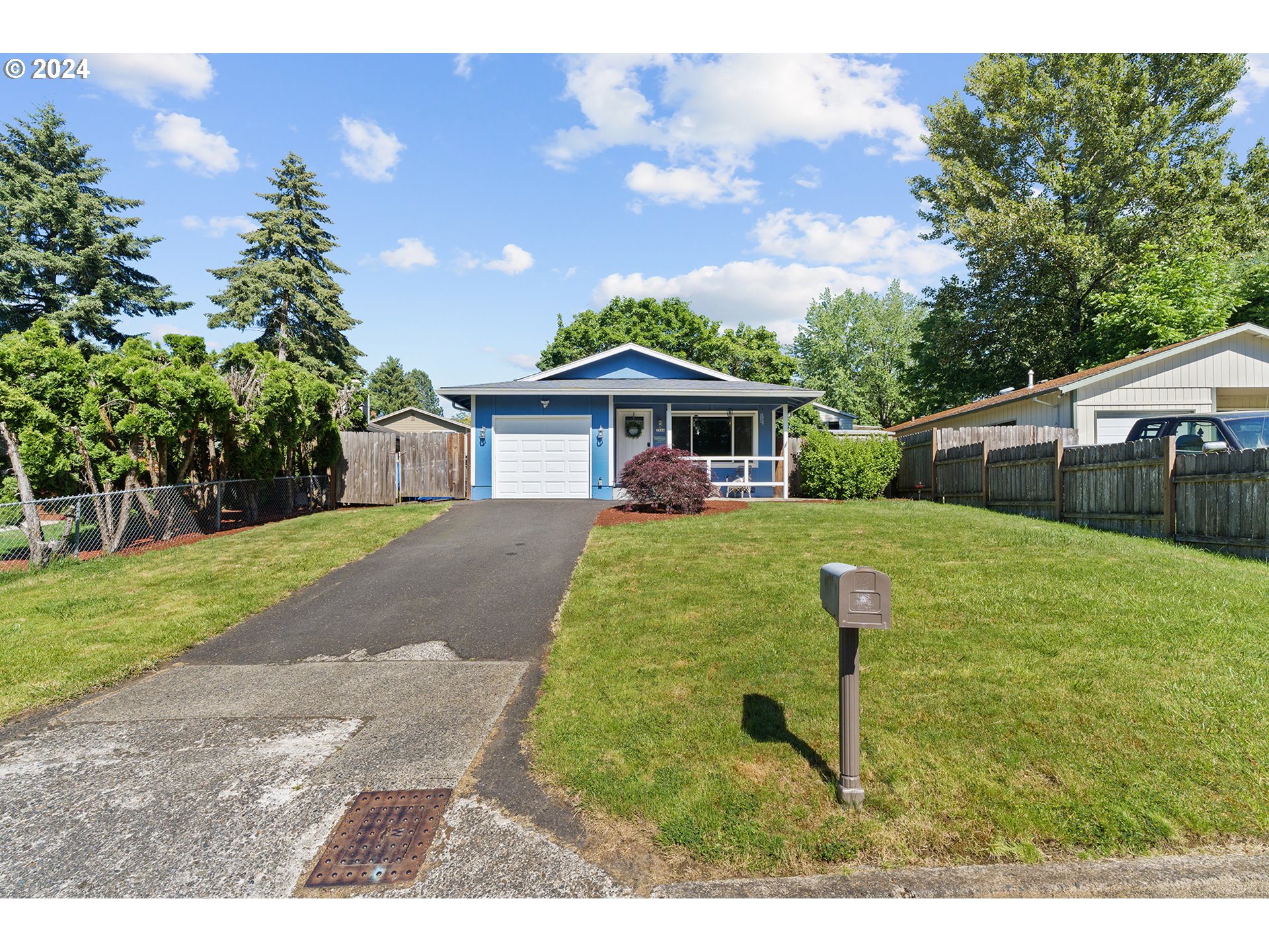 7946 Southeast 103rd Avenue Portland, OR 97266 - Photo 3 of 32 a view of house with garden