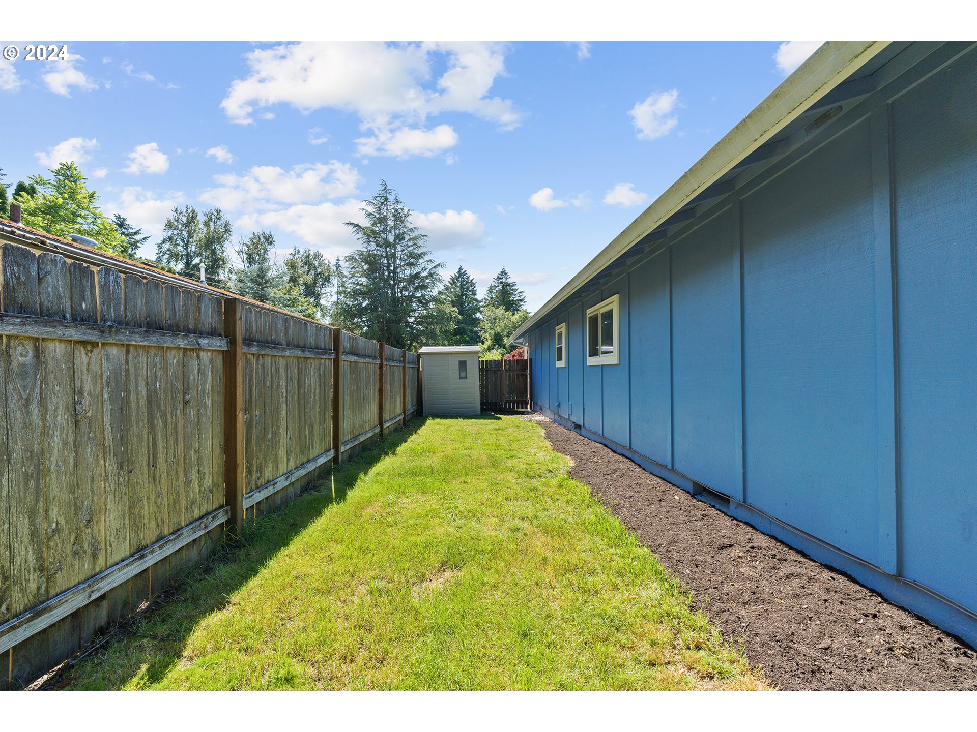 7946 Southeast 103rd Avenue Portland, OR 97266 - Photo 31 of 32 a view of backyard with wooden fence