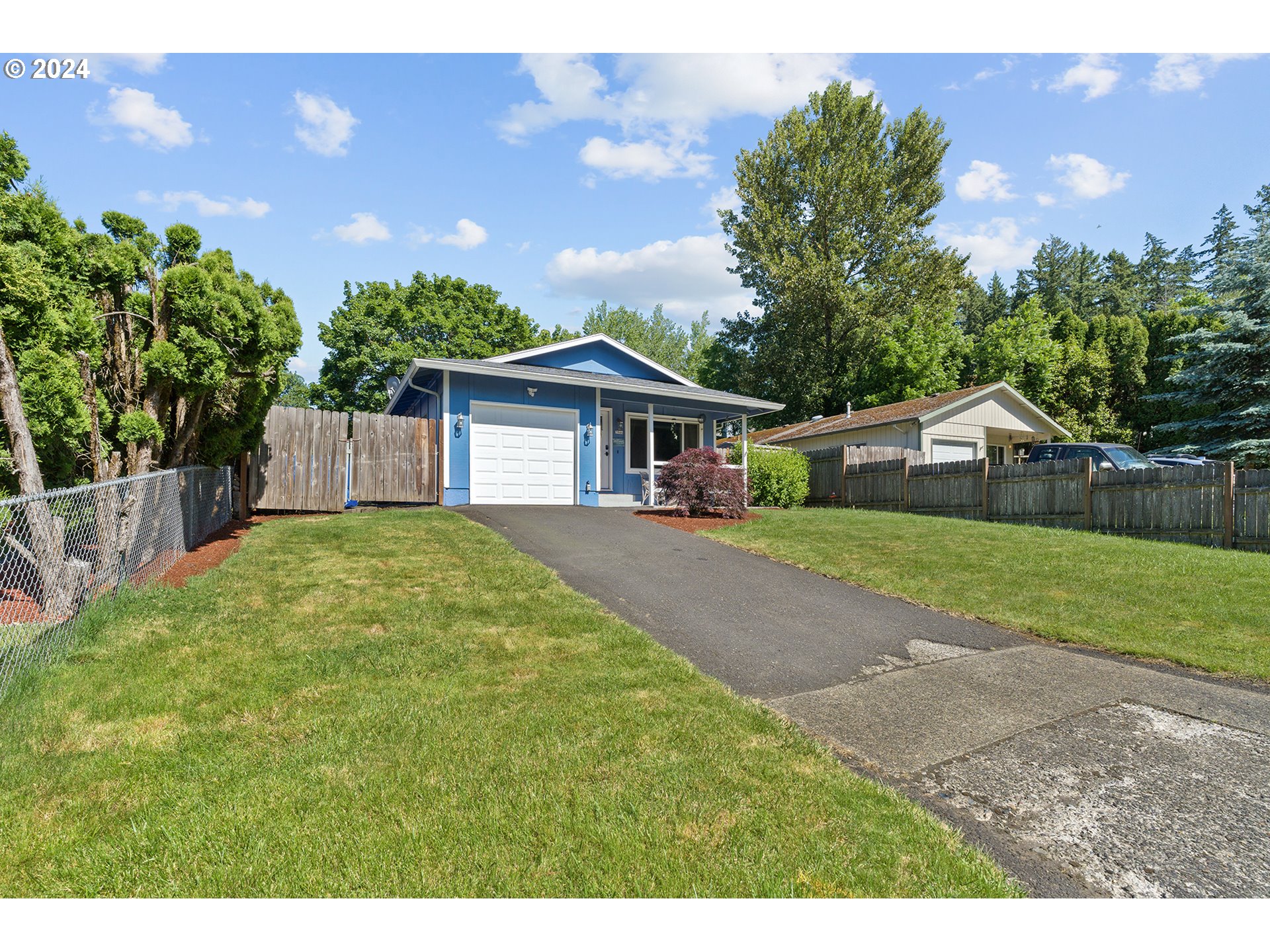 7946 Southeast 103rd Avenue Portland, OR 97266 - Photo 5 of 32 a front view of house with yard and green space