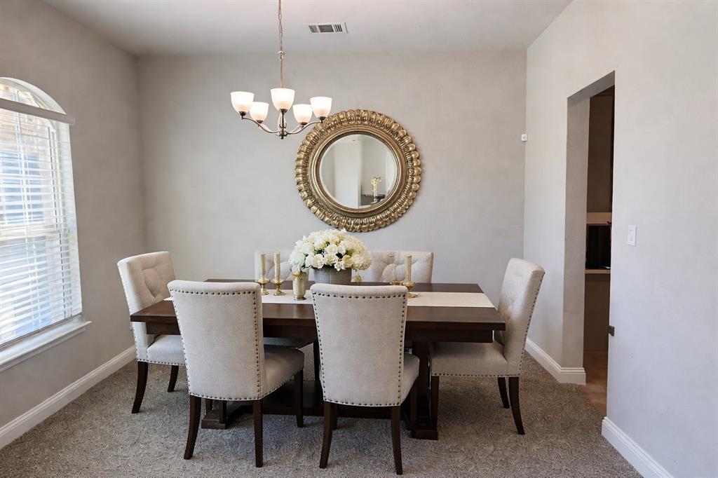 10638 Cherry Tree Way Grand Prairie, TX 76065 - Photo 9 of 39 Virtually staged formal dining room with natural lighting