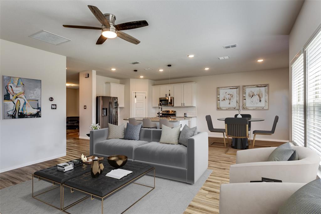 516 Palmito Ranch Road Fort Worth, TX 76131 - Photo 11 of 32 a living room with furniture couches and a dining table with wooden floor