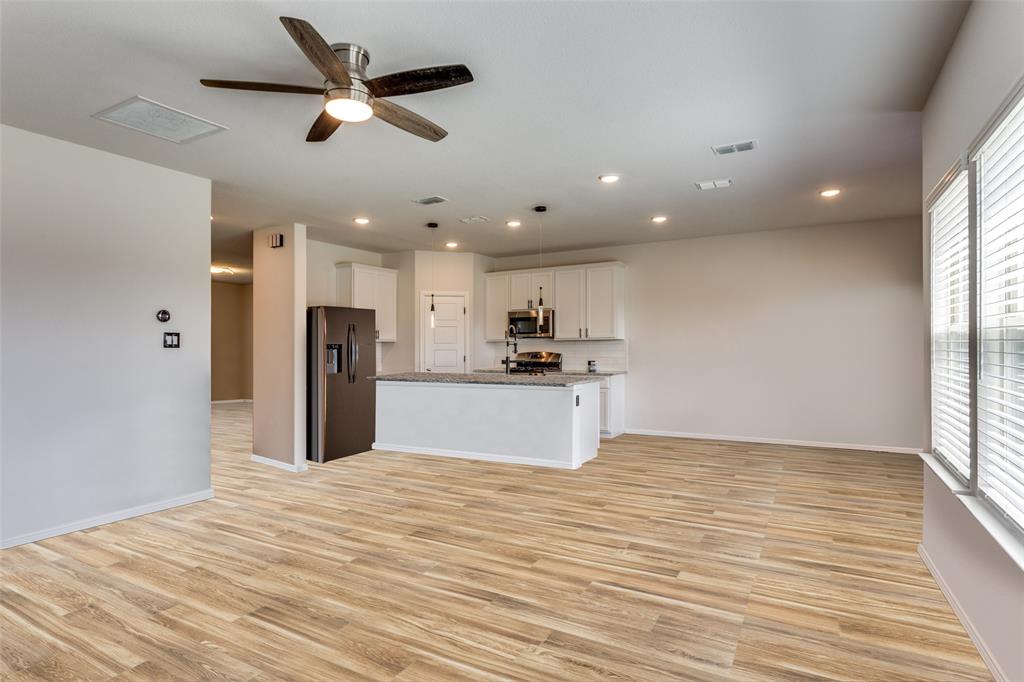 516 Palmito Ranch Road Fort Worth, TX 76131 - Photo 32 of 32 a view of kitchen with refrigerator microwave and stove