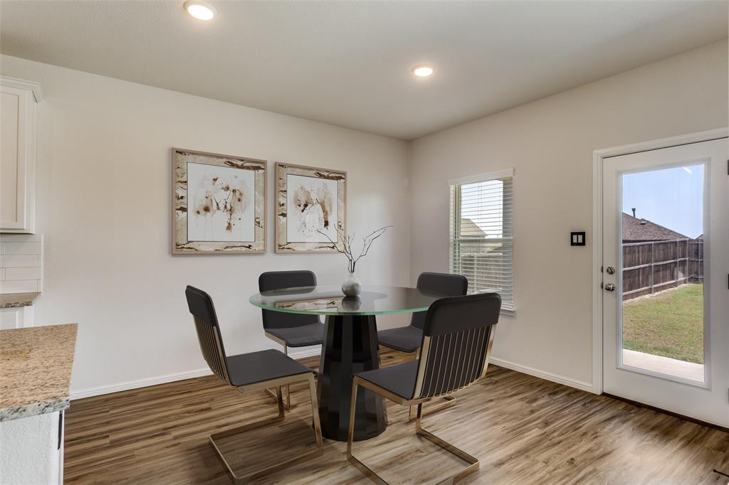 516 Palmito Ranch Road Fort Worth, TX 76131 - Photo 12 of 32 a view of a dining room with furniture and wooden floor