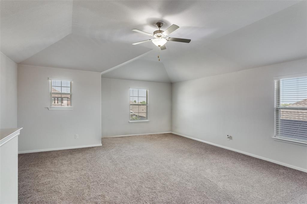 516 Palmito Ranch Road Fort Worth, TX 76131 - Photo 23 of 32 a view of a livingroom with a ceiling fan and window