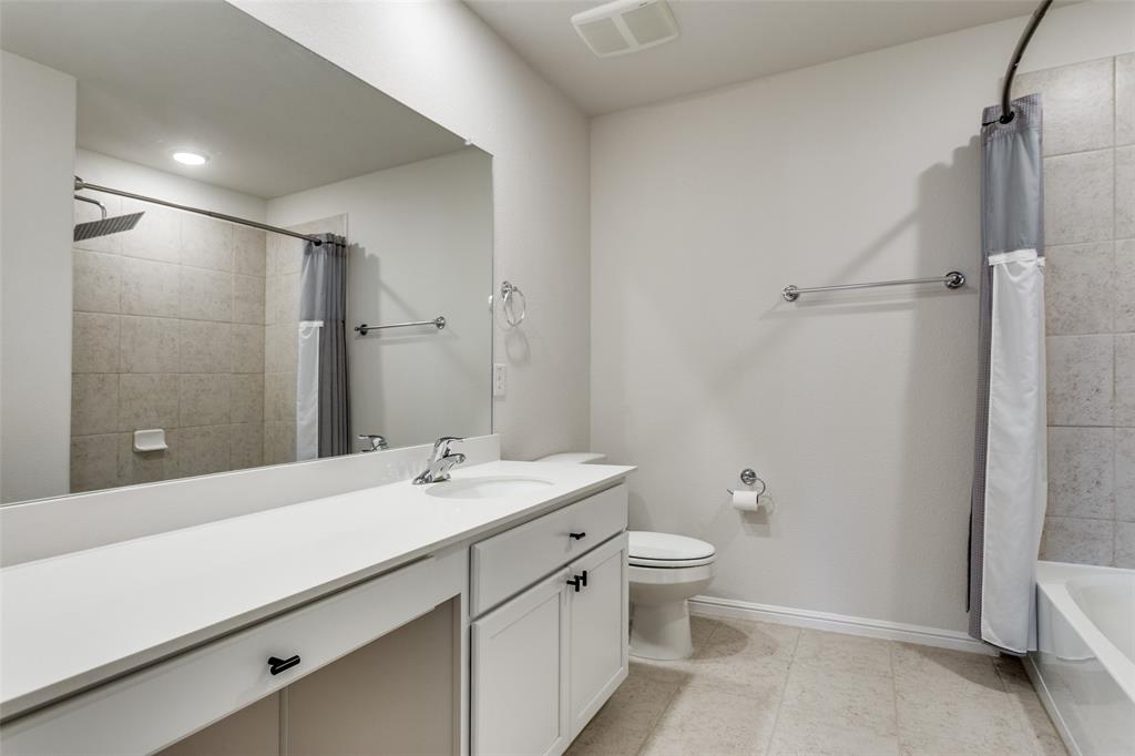 516 Palmito Ranch Road Fort Worth, TX 76131 - Photo 27 of 32 a bathroom with a sink a toilet and shower