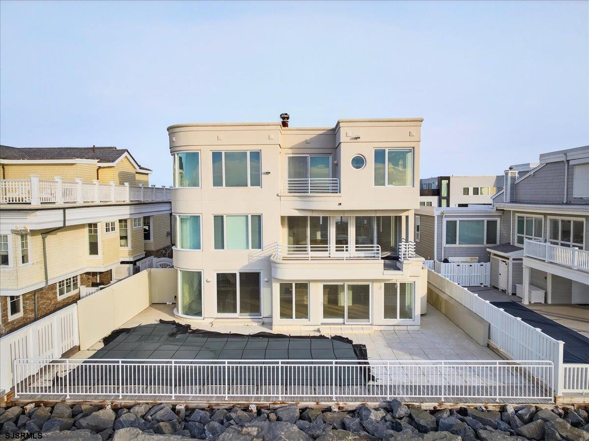 9 Point Drive Longport, NJ 08403 - Photo 21 of 38 a front view of a building with glass windows