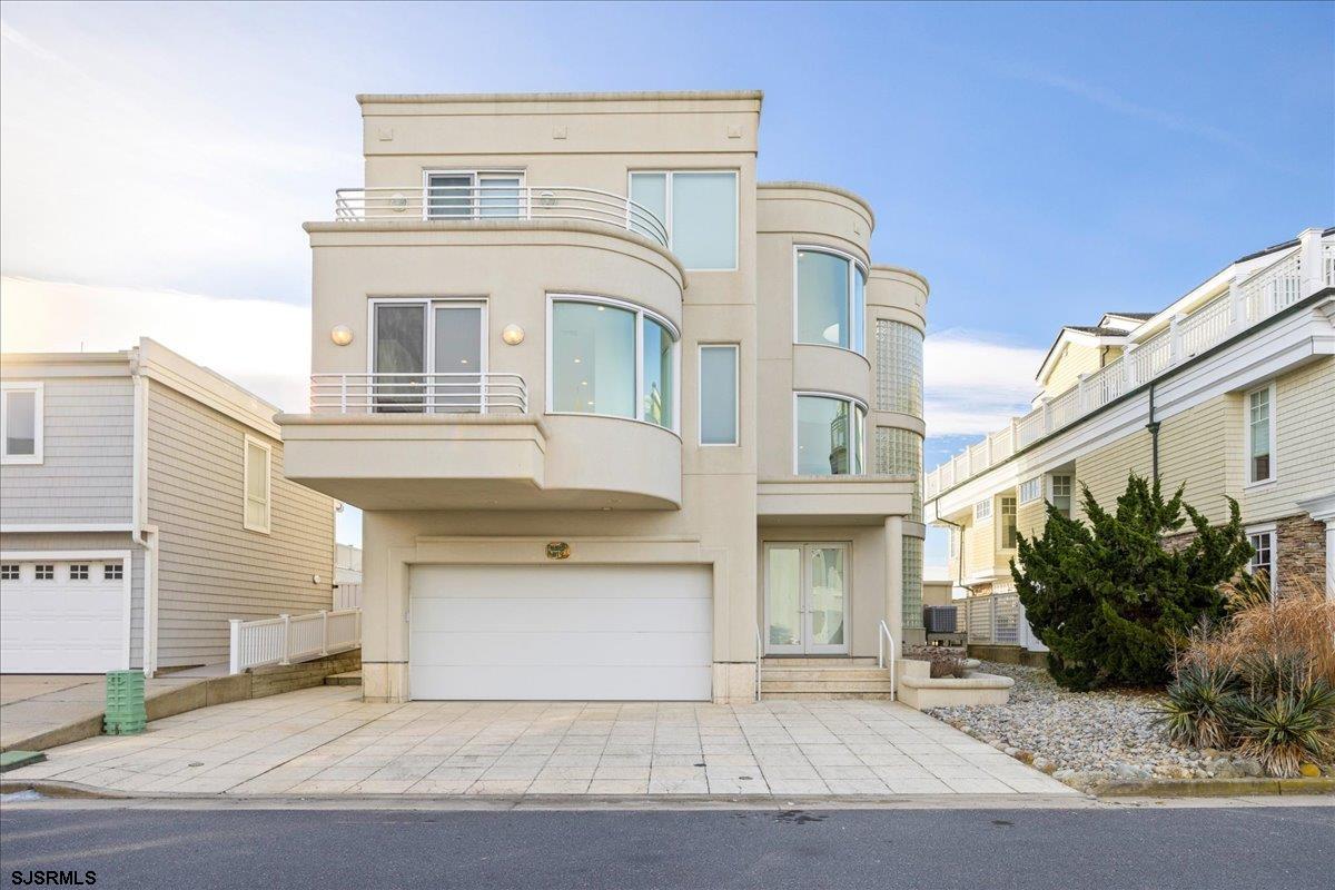 9 Point Drive Longport, NJ 08403 - Photo 5 of 38 a front view of a house with garden