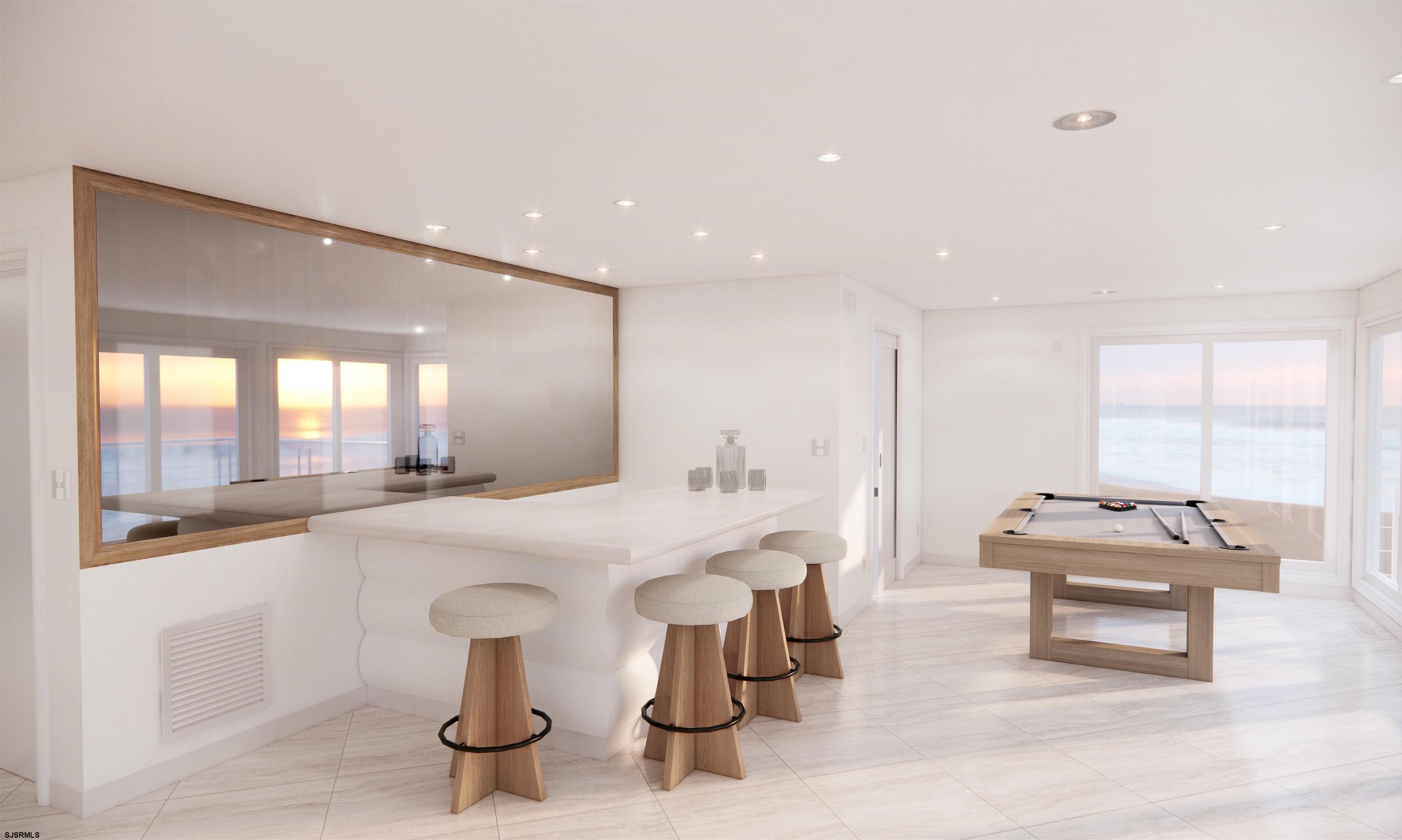 9 Point Drive Longport, NJ 08403 - Photo 10 of 38 a large white kitchen with a large window