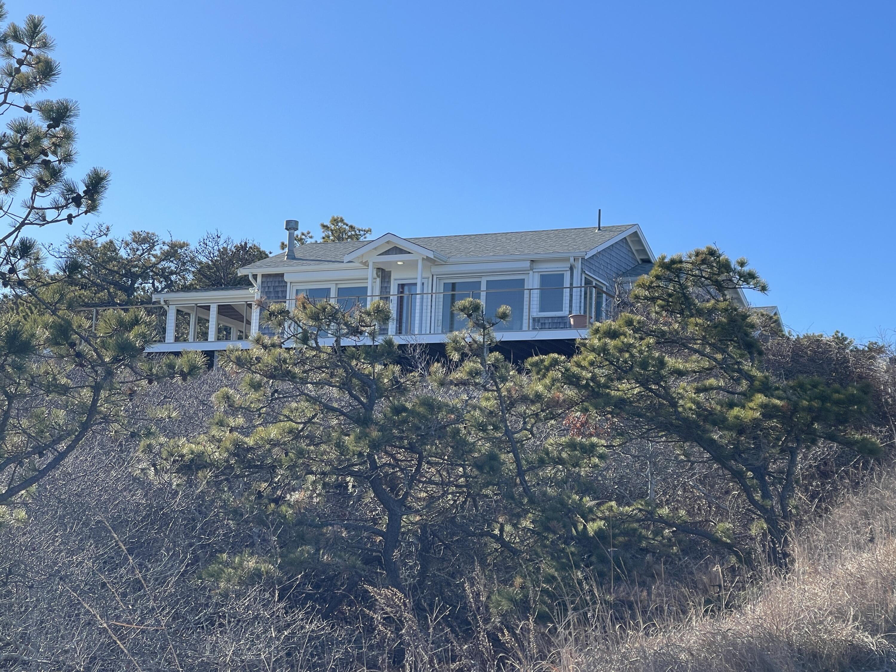 a view of a house with a yard and balcony