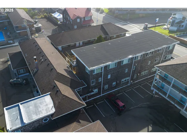 an aerial view of houses with yard