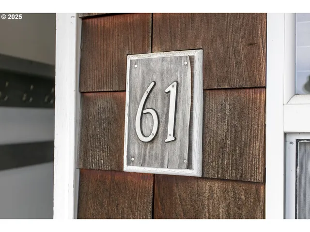 a wall with painting on it and wooden door