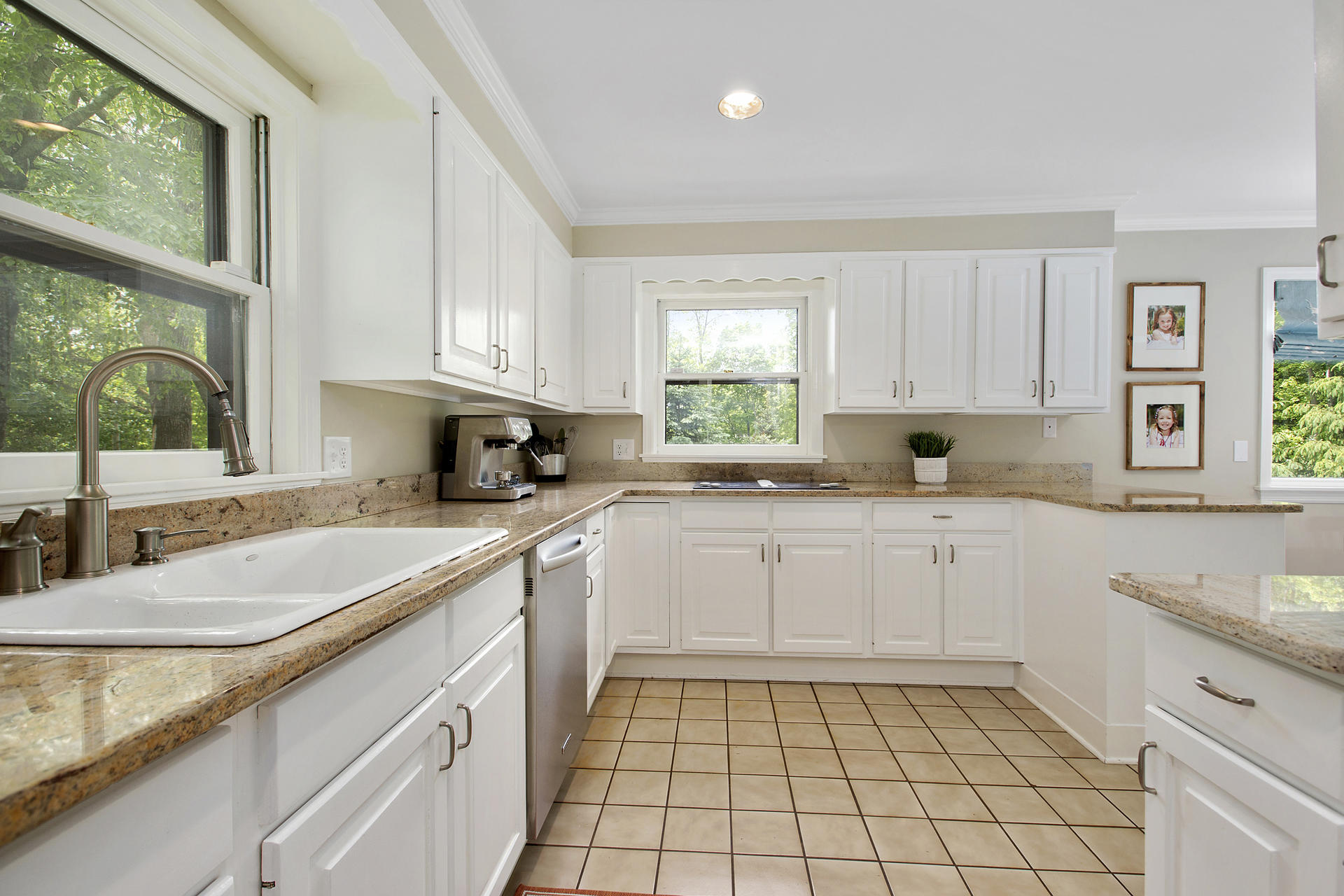17 Old Oak Road Darien, CT 06820 - Photo 12 of 28 a kitchen with a sink window and cabinets