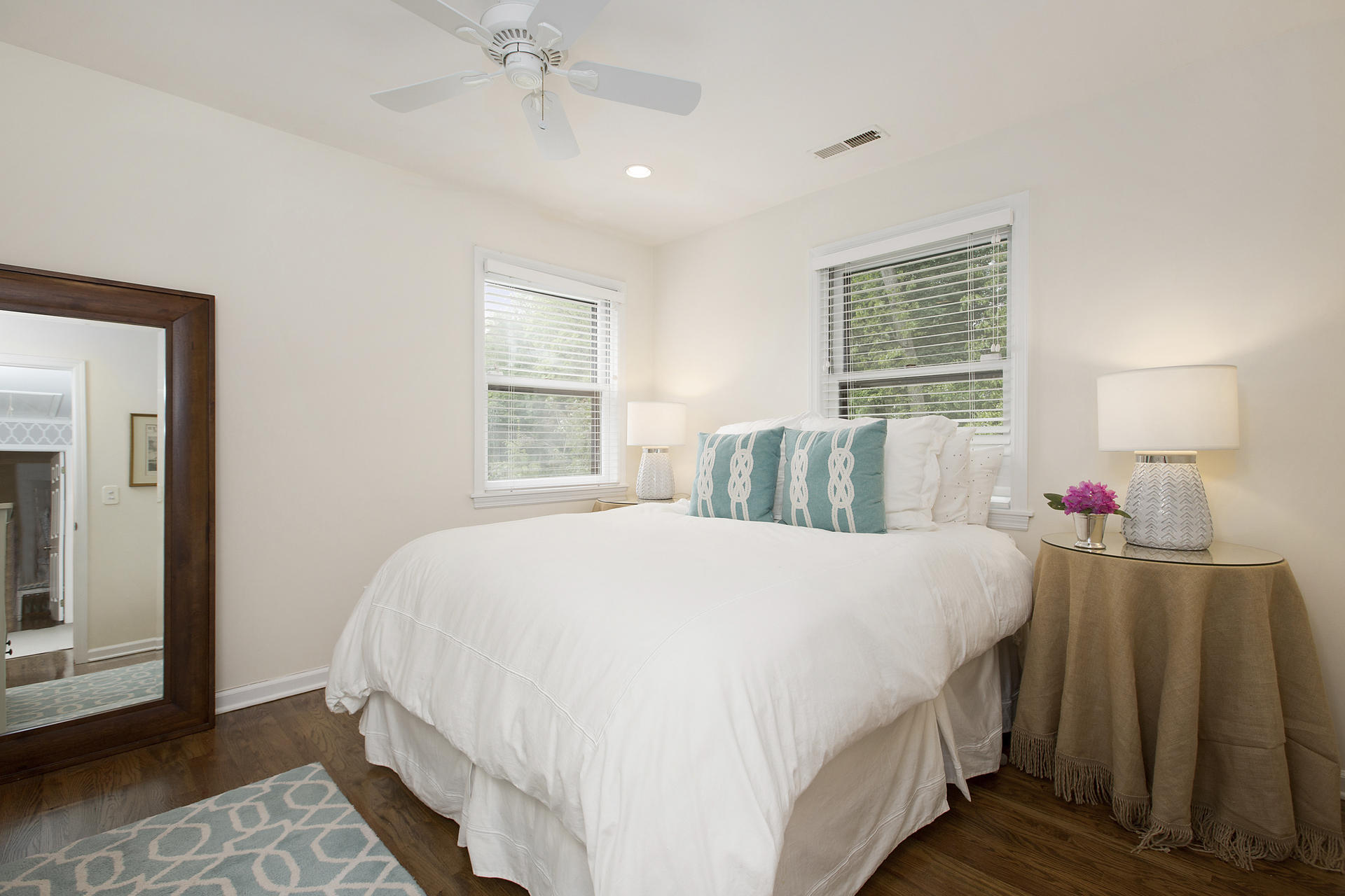 17 Old Oak Road Darien, CT 06820 - Photo 21 of 28 a bedroom with a bed and a chandelier