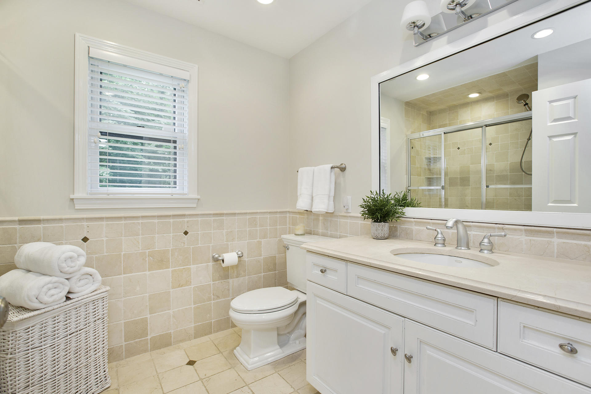 17 Old Oak Road Darien, CT 06820 - Photo 24 of 28 a bathroom with a sink a toilet and a mirror