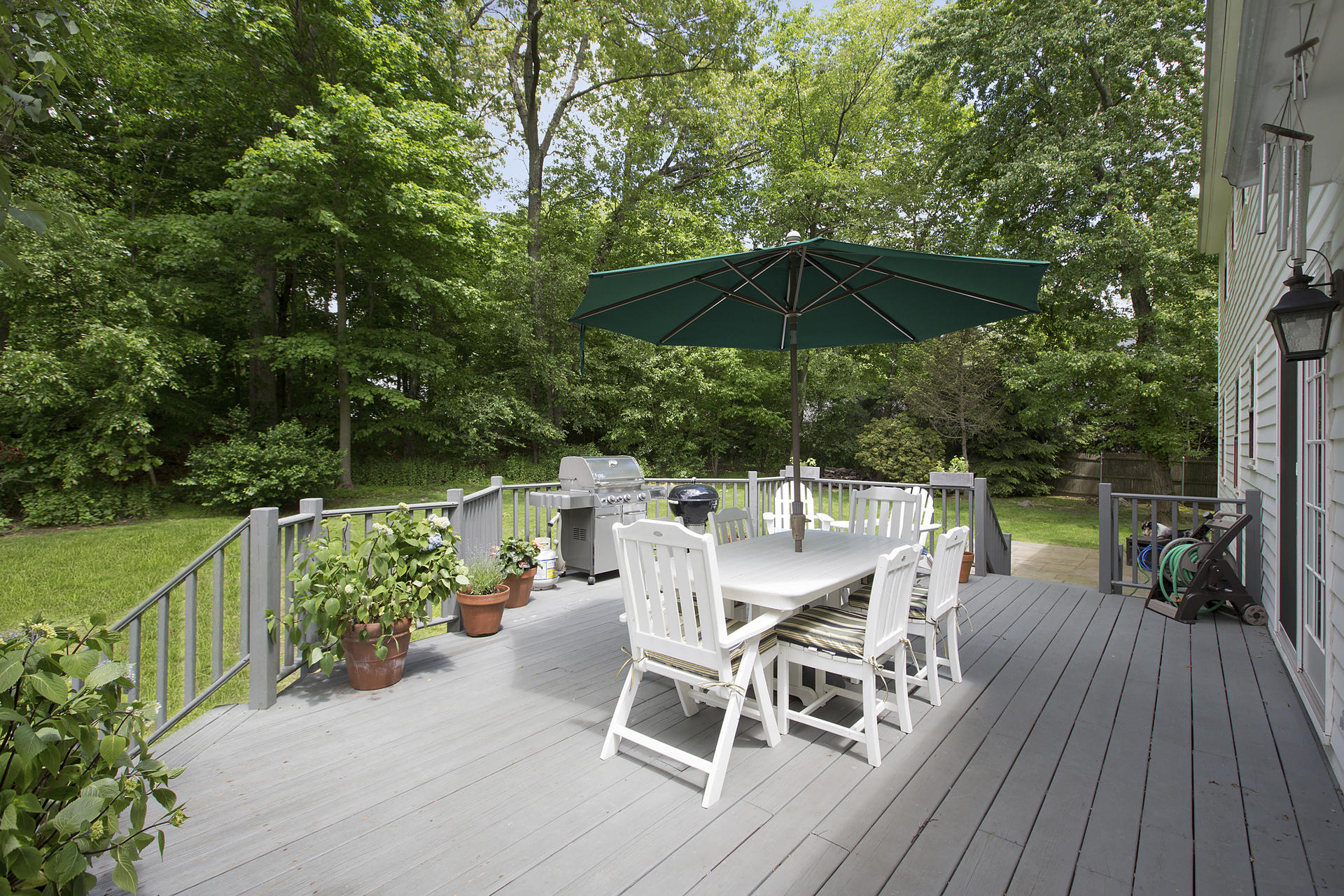 17 Old Oak Road Darien, CT 06820 - Photo 27 of 28 a view of a chairs and table on the wooden deck