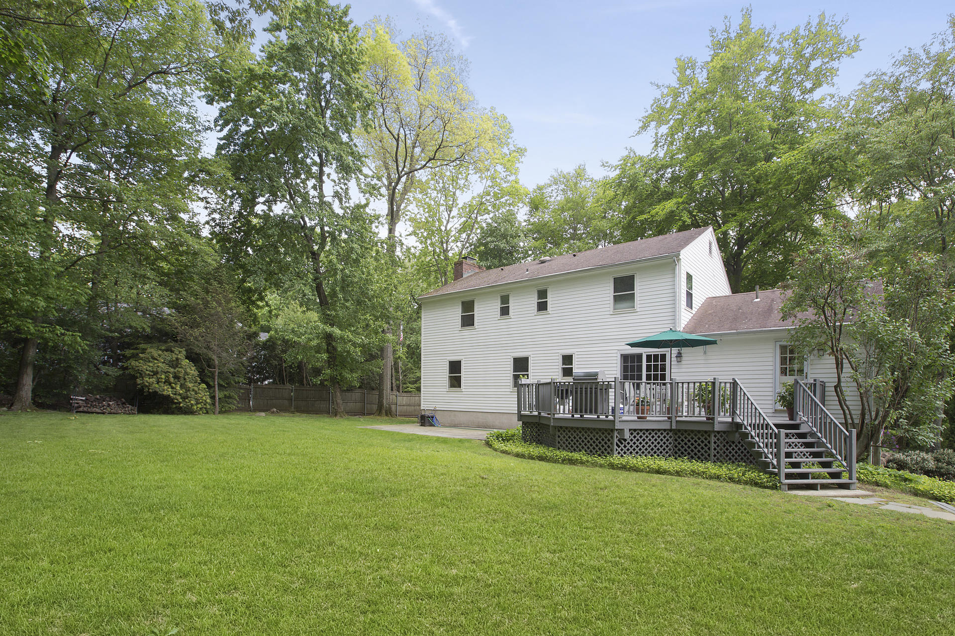 17 Old Oak Road Darien, CT 06820 - Photo 28 of 28 a view of a house with a backyard and a patio