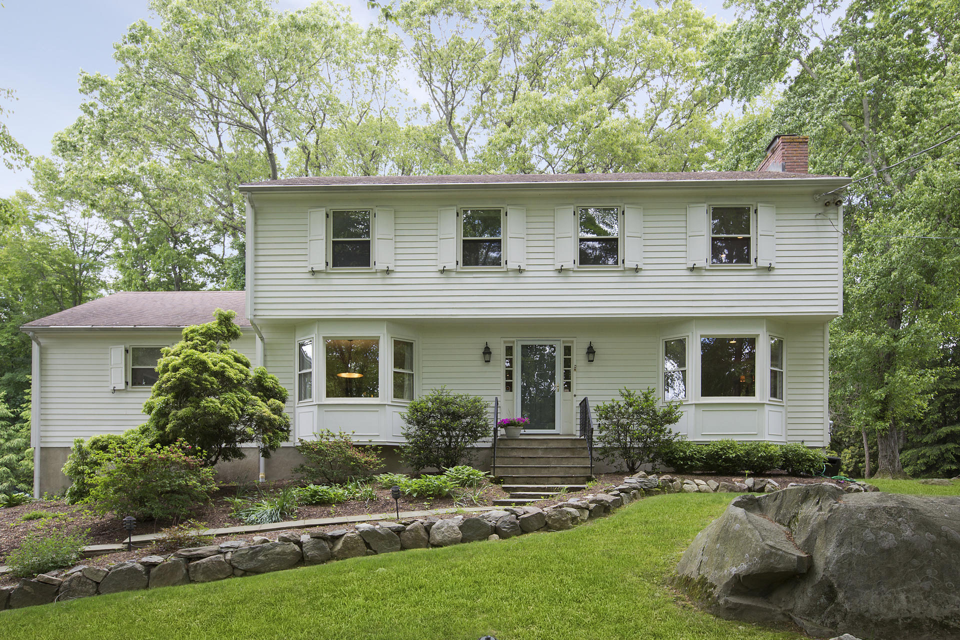 17 Old Oak Road Darien, CT 06820 - Photo 3 of 28 a front view of a house with a yard