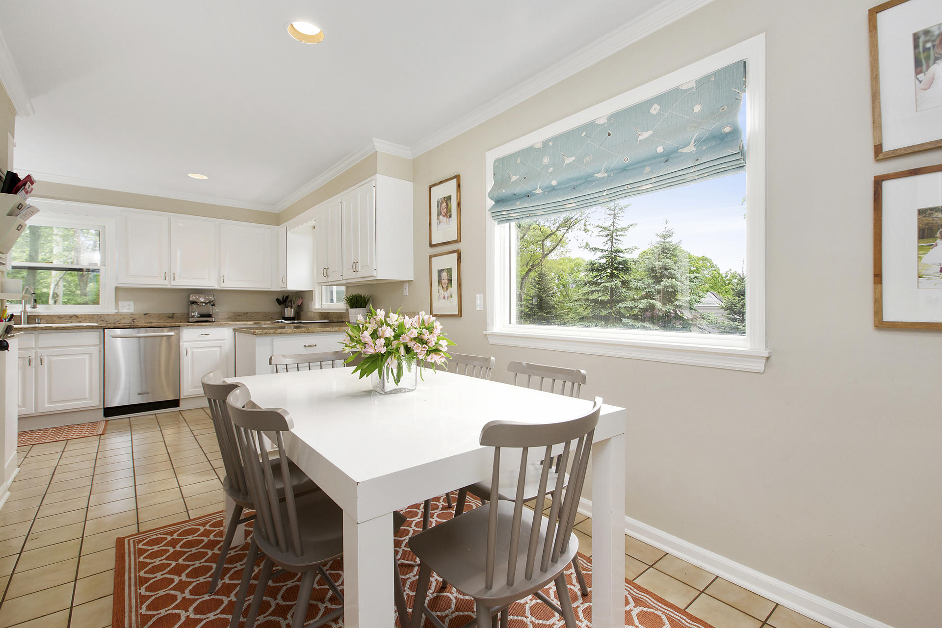 17 Old Oak Road Darien, CT 06820 - Photo 10 of 28 a kitchen with a dining table chairs and window