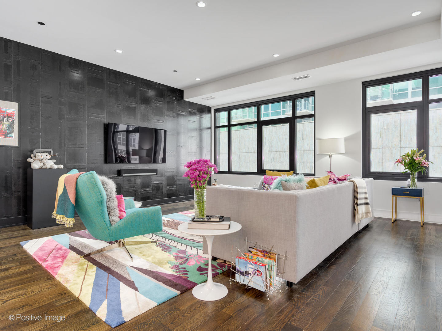a living room with furniture and a large window