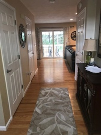 309 Acropolis Road Lowell, MA 01854 - Photo 4 of 29 a view of entryway and hall with wooden floor