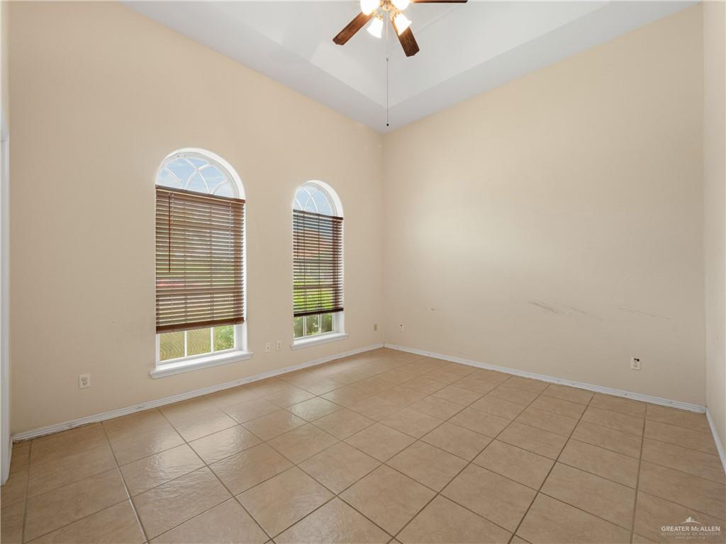 4414 Water's Edge Harlingen, TX 78552 - Photo 11 of 32 an empty room with windows and fan