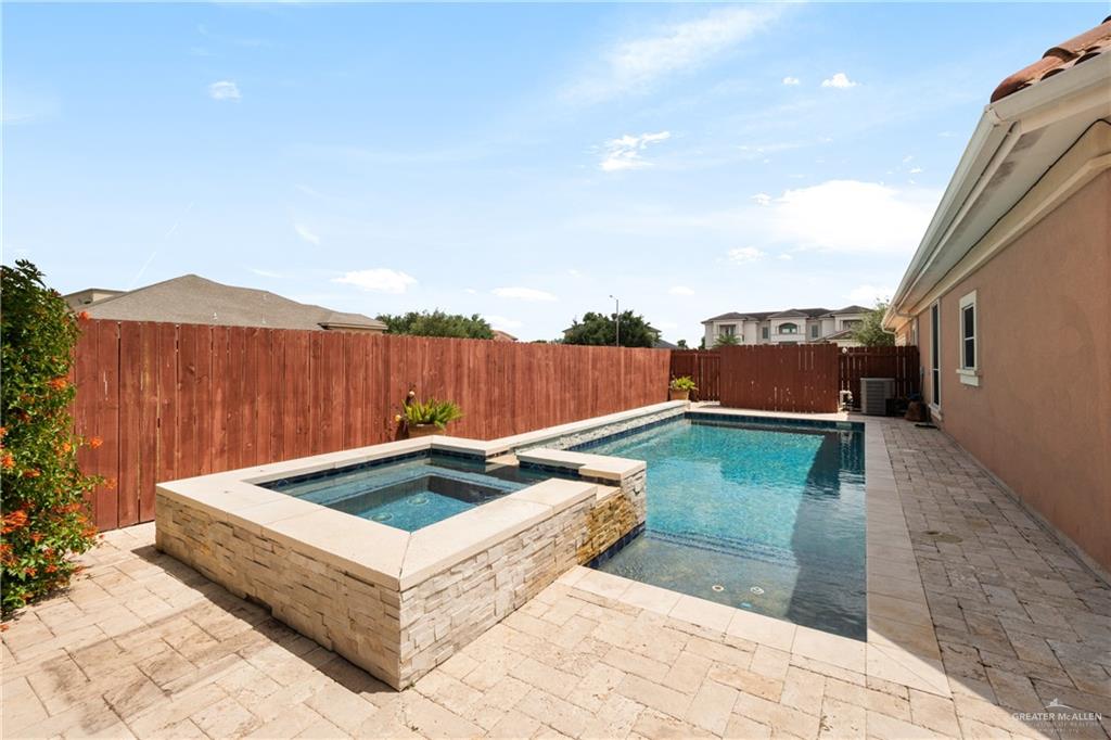 4414 Water's Edge Harlingen, TX 78552 - Photo 27 of 32 a backyard of a house with table and chairs