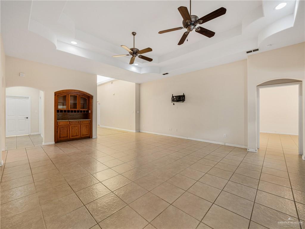 4414 Water's Edge Harlingen, TX 78552 - Photo 4 of 32 a view of a livingroom with a ceiling fan and window