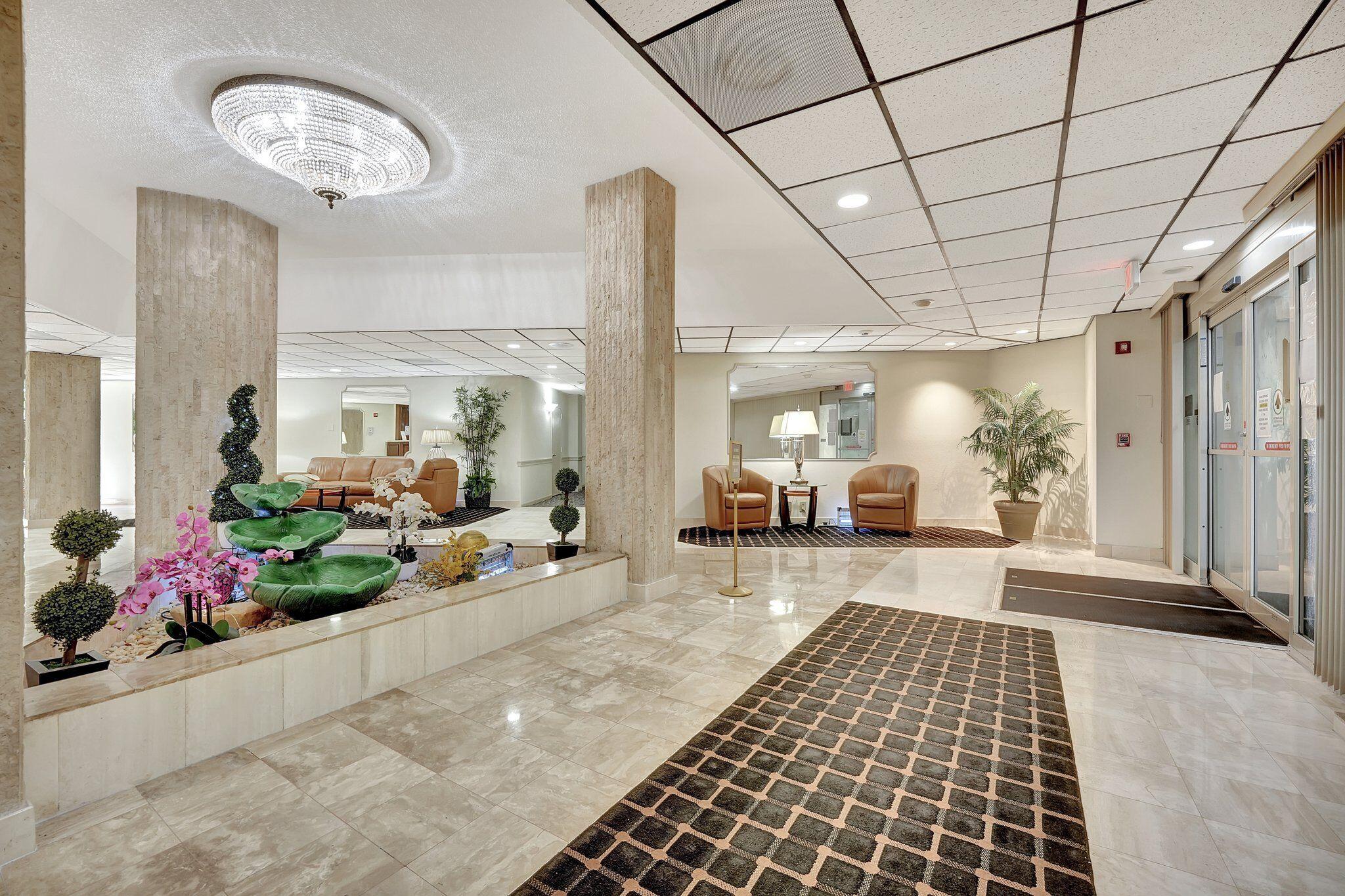 10777 West Sample Road, Unit 207 Coral Springs, FL 33065 - Photo 31 of 48 a very nice looking room with a large window