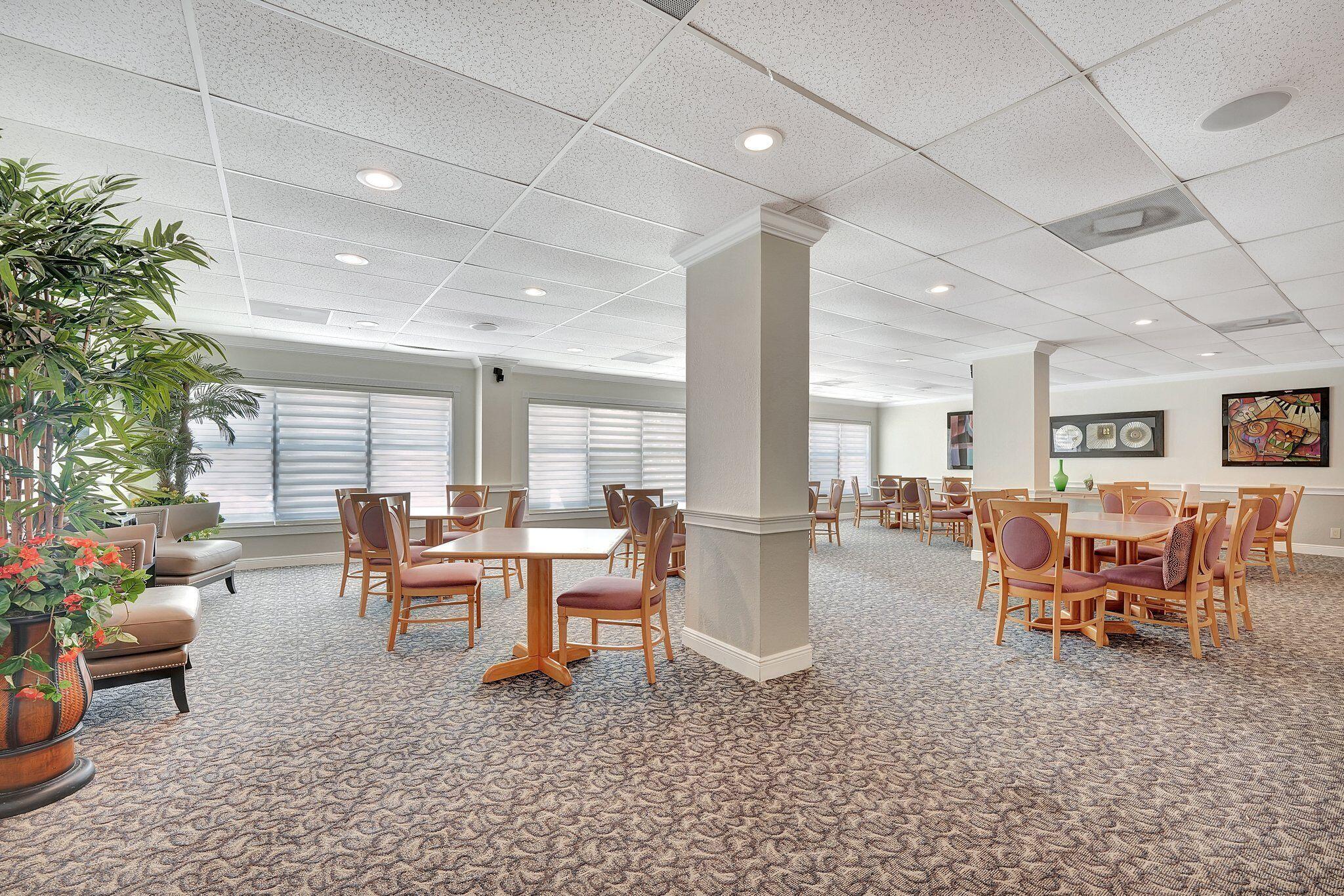 10777 West Sample Road, Unit 207 Coral Springs, FL 33065 - Photo 34 of 48 a living room with furniture and a large window