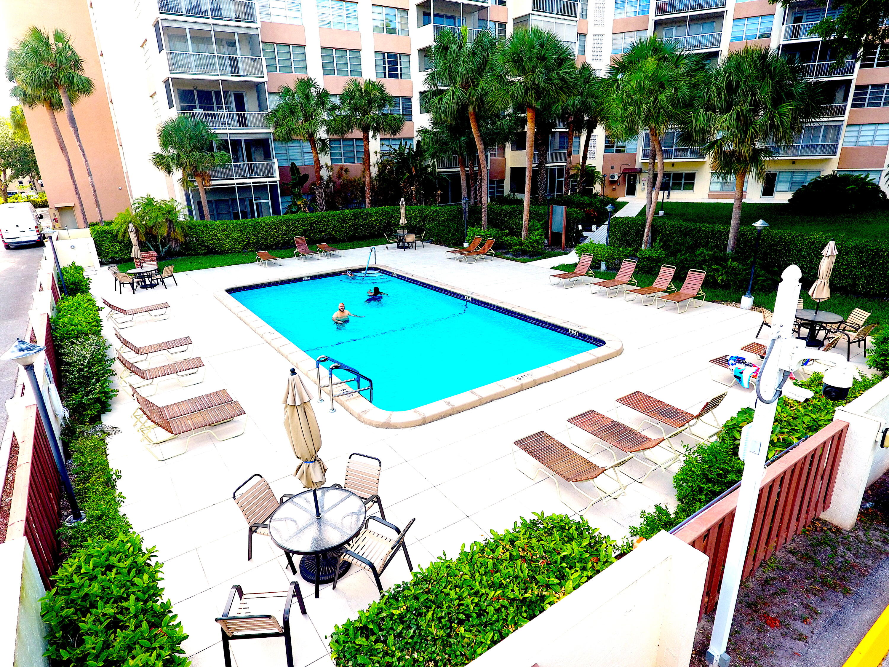 10777 West Sample Road, Unit 207 Coral Springs, FL 33065 - Photo 41 of 48 a view of outdoor space yard and swimming pool