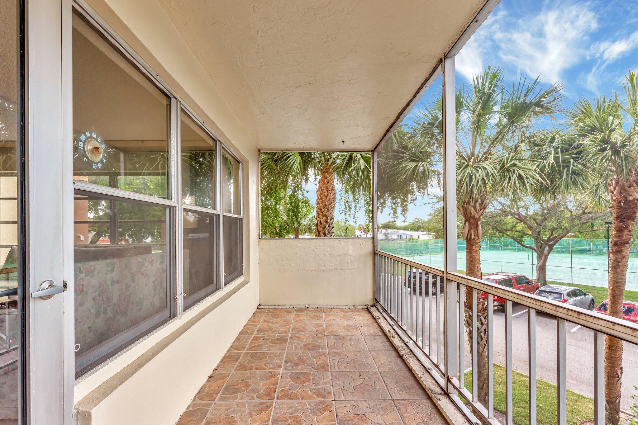 10777 West Sample Road, Unit 207 Coral Springs, FL 33065 - Photo 46 of 48 a view of a building from a balcony