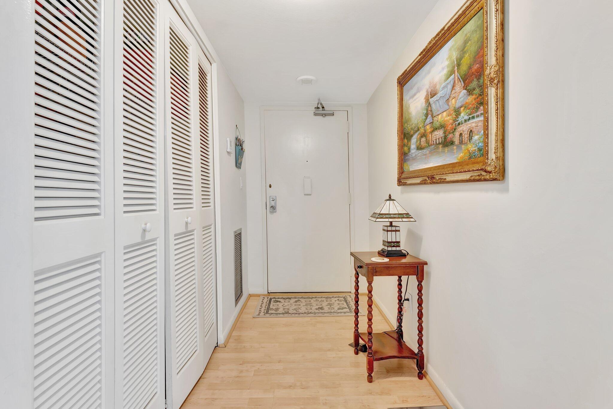 10777 West Sample Road, Unit 207 Coral Springs, FL 33065 - Photo 5 of 48 a view of a hallway with seating area