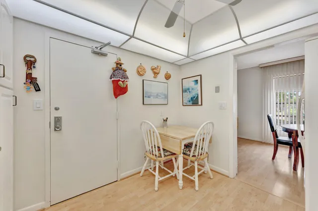 a bedroom with a bed and a flat tv screen on the dresser