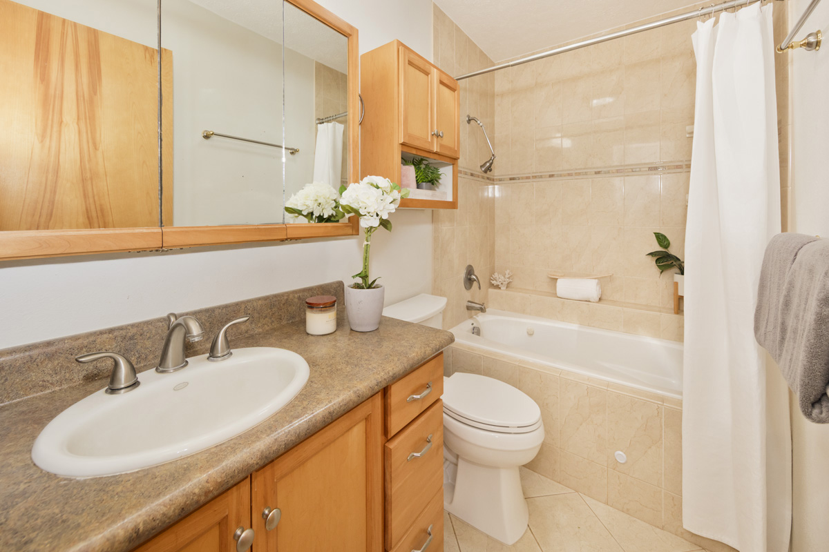 49 Iiwipolena Road Hilo, HI 96720 - Photo 11 of 30 a bathroom with a granite countertop sink toilet and shower