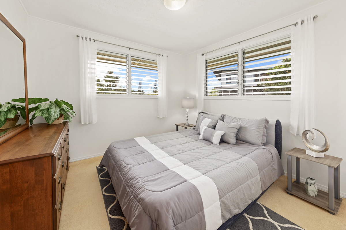 49 Iiwipolena Road Hilo, HI 96720 - Photo 12 of 30 a bedroom with a bed and a window