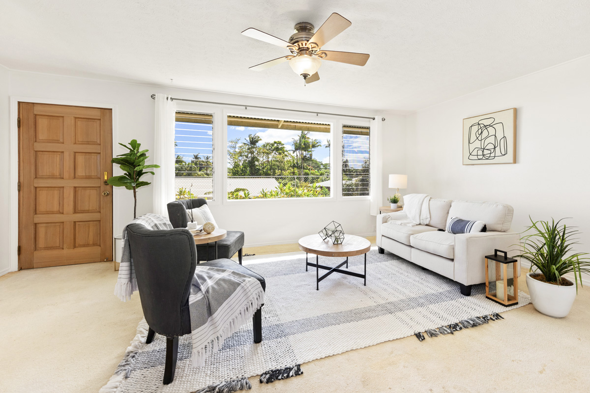 49 Iiwipolena Road Hilo, HI 96720 - Photo 3 of 30 a living room with furniture and a large window