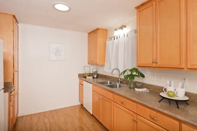 a kitchen with a sink and cabinets