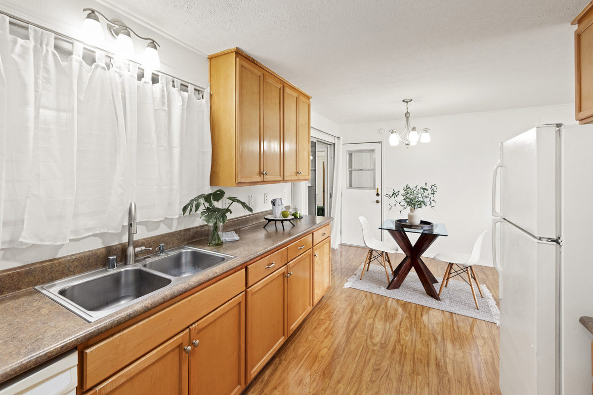 49 Iiwipolena Road Hilo, HI 96720 - Photo 9 of 30 a kitchen with stainless steel appliances a sink a counter space and a window
