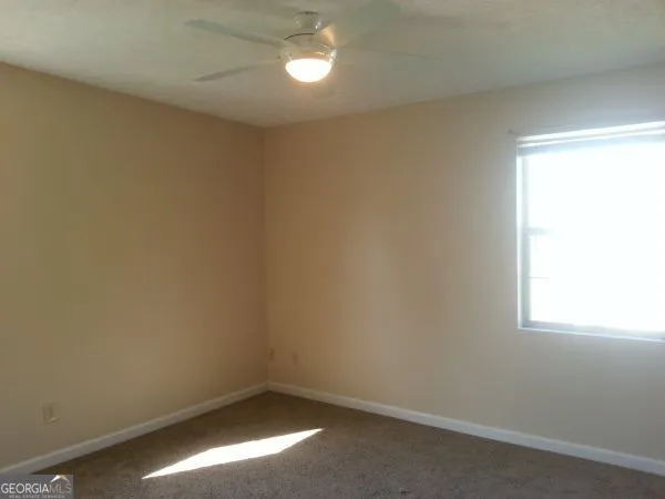 a view of house with roof deck