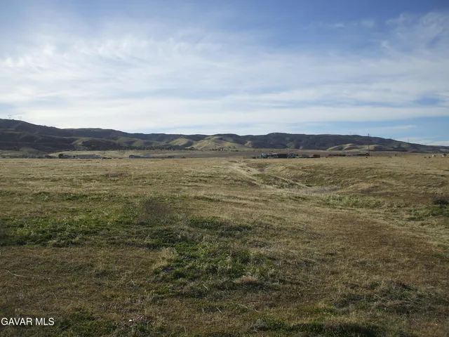 a view of an ocean and a mountain