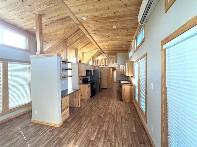 a view of a kitchen with furniture and a fireplace